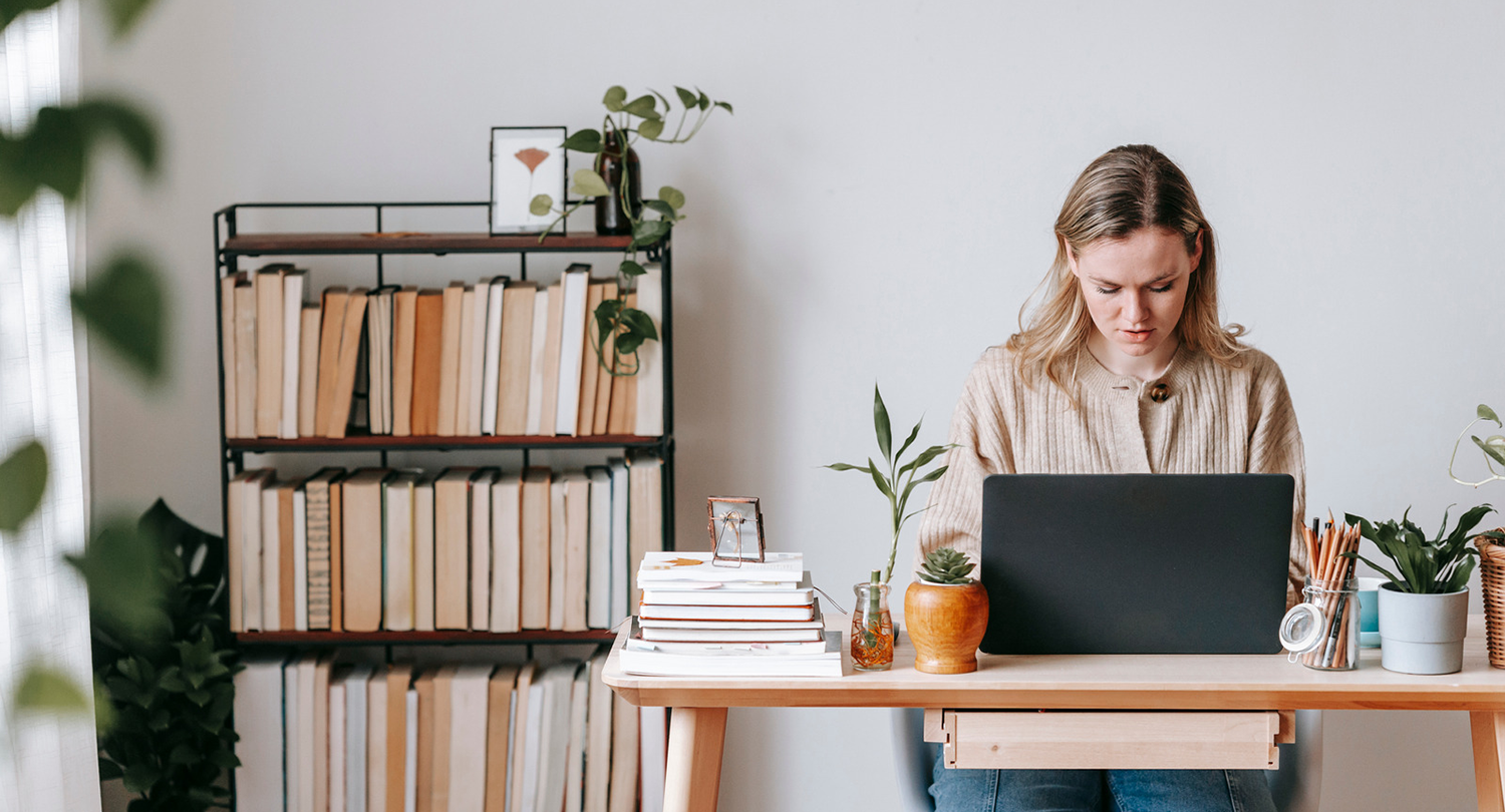 Photo of woman working from home on a laptop
